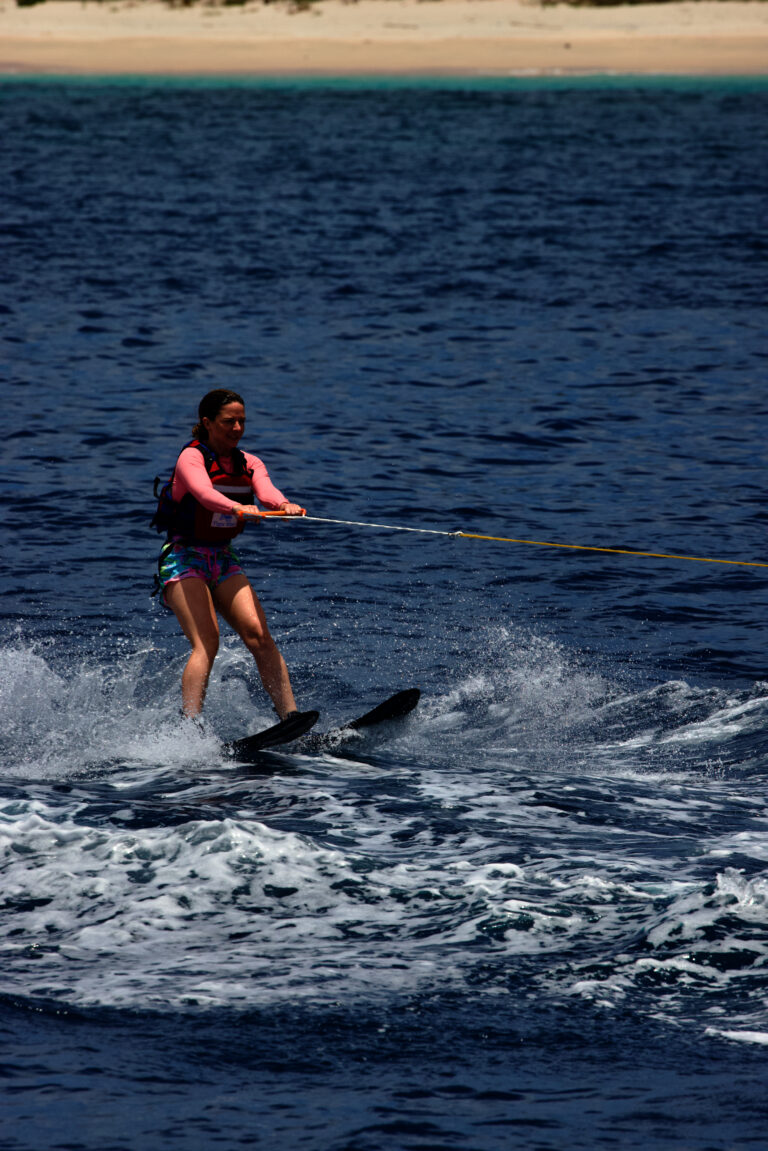 Guest water-skiing behind the tender