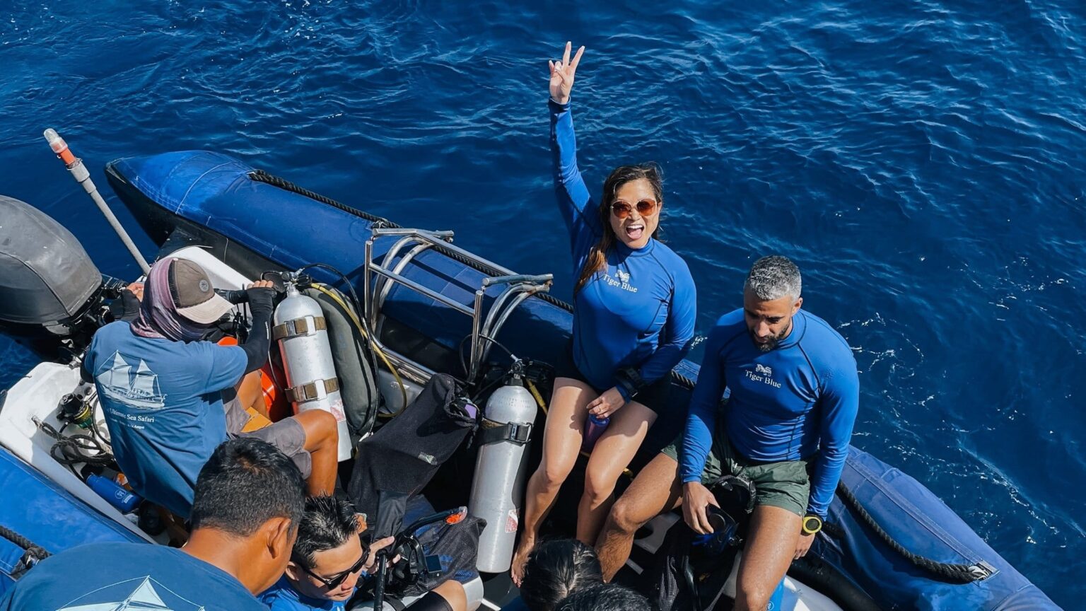 Guests and dive crew in the tender after a dive
